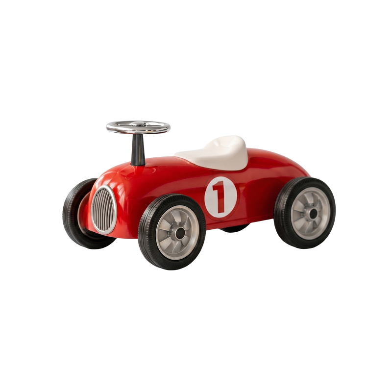Classic red retro ride-on race car with chrome steering wheel and number 1 decal on white background