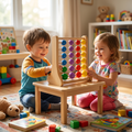 White toddler boy teal orange long-sleeve White toddler girl rainbow print top sitting either side small wooden table sliding beads rainbow abacus together grinning colourful blocks teddy bear puzzle toy car play rug sunlit nursery