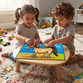 Indian pigtail girl grey tee curly-haired boy grey henley sitting cream shag rug small round natural pine table both grinning almost-complete horse puzzle assembled boy placing final piece colourful wooden blocks toy cars farm animal book