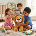 Three children sitting on playroom floor laughing and placing a knitted crown on Leo the Lion plush toy